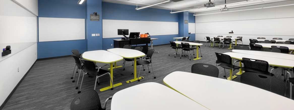Open space in an office showcasing Polyvision, big table, and flex
