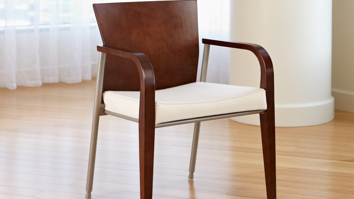 Front view of Mingle Guest Chair with white seat and medium walnut dark wood arms and back