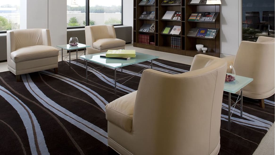 Four Thoughtful Lounge Chairs next to bookshelves