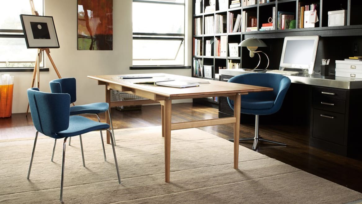 Dining Table CH327 in an office with three blue chairs around it