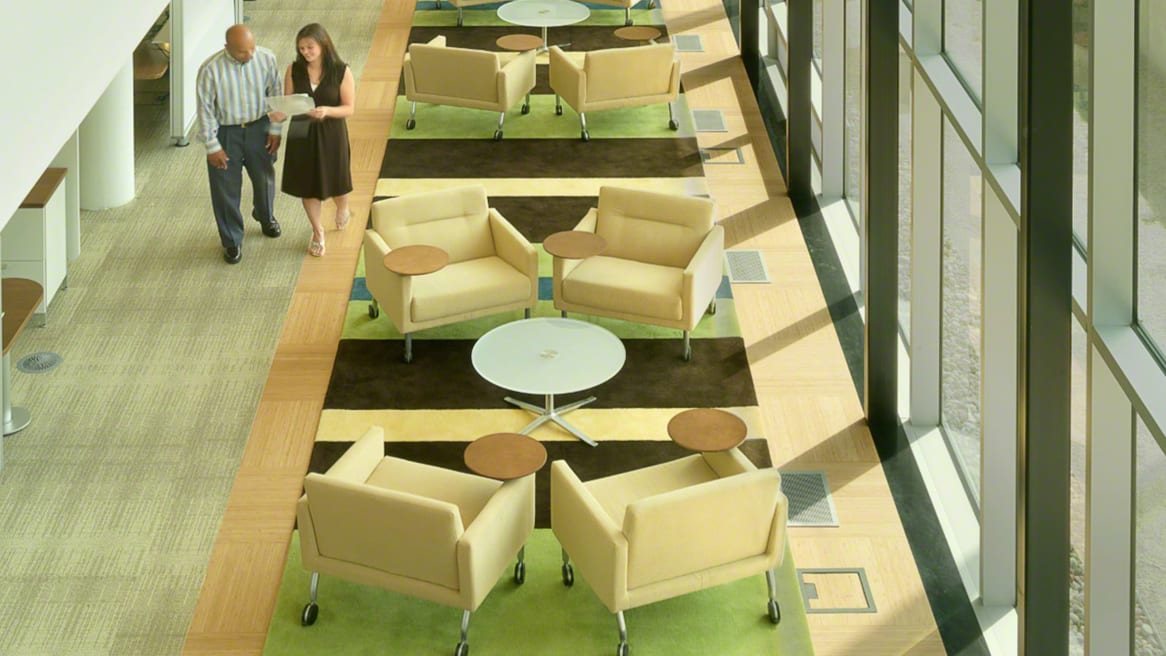 Sidewalk Lounge areas in a common area of an office with four Sidewalk Lounge Chairs and a round coffee tables