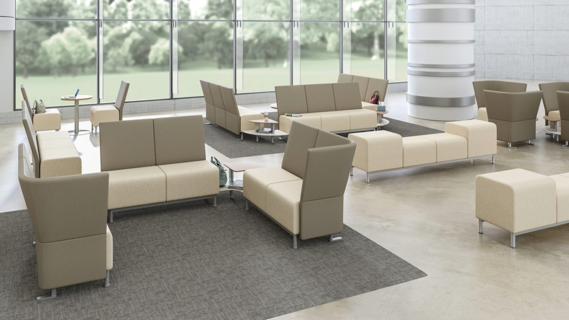 Neighbor lounge seating and benches in a large waiting room