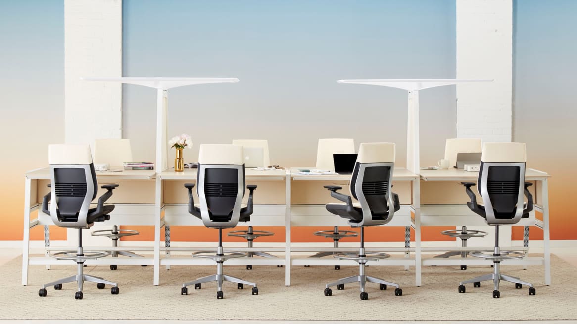 Bivi desks create a workstation for 8 people with Gesture chairs in stool height and Bivi canopies attached to the desks