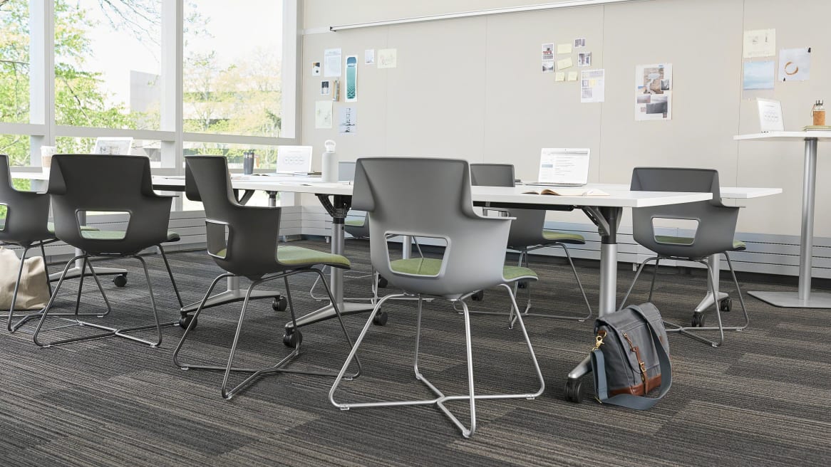 Shortcut X Base chairs around desk tables in classroom