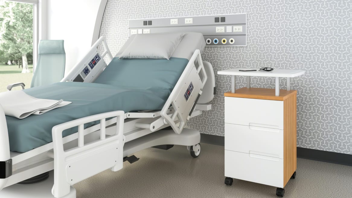 A Park Mobile cabinet with three drawers is shown next to a hospital bed