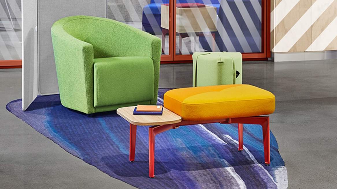 A Bassline bench with yellow upholstery and attached side table is seen across from a Jenny Round chair and Campfire Pouf with green upholstery. A Clipper screen is shown in the background.