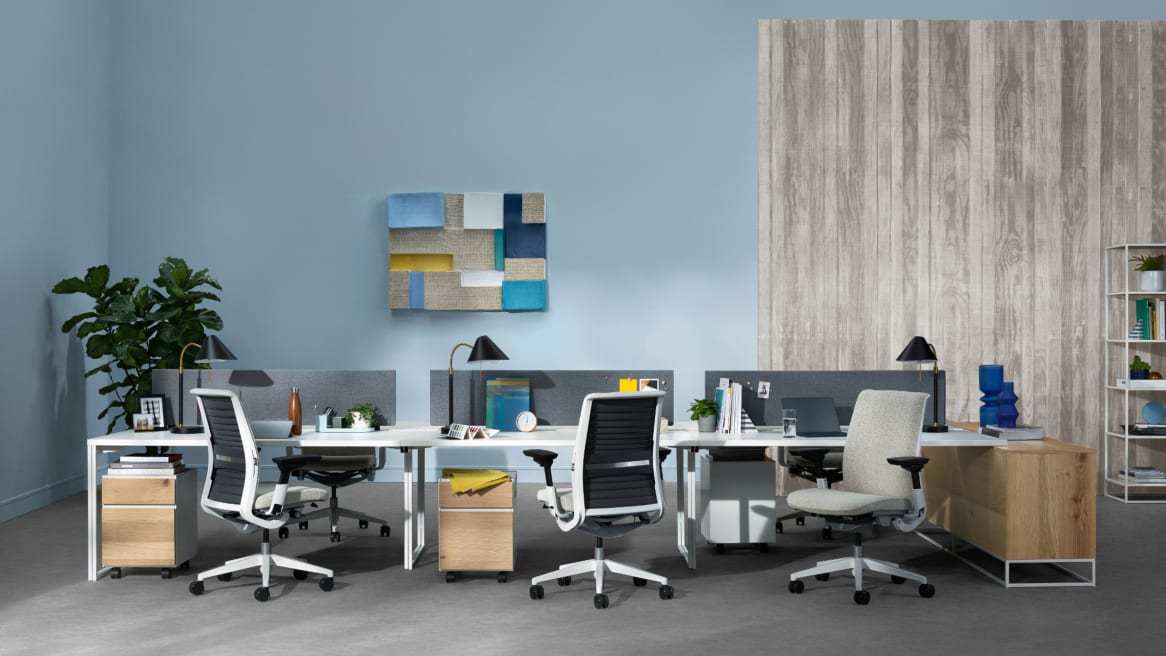 office desk system for six with beige upholstered office chairs and personal storage cabinets