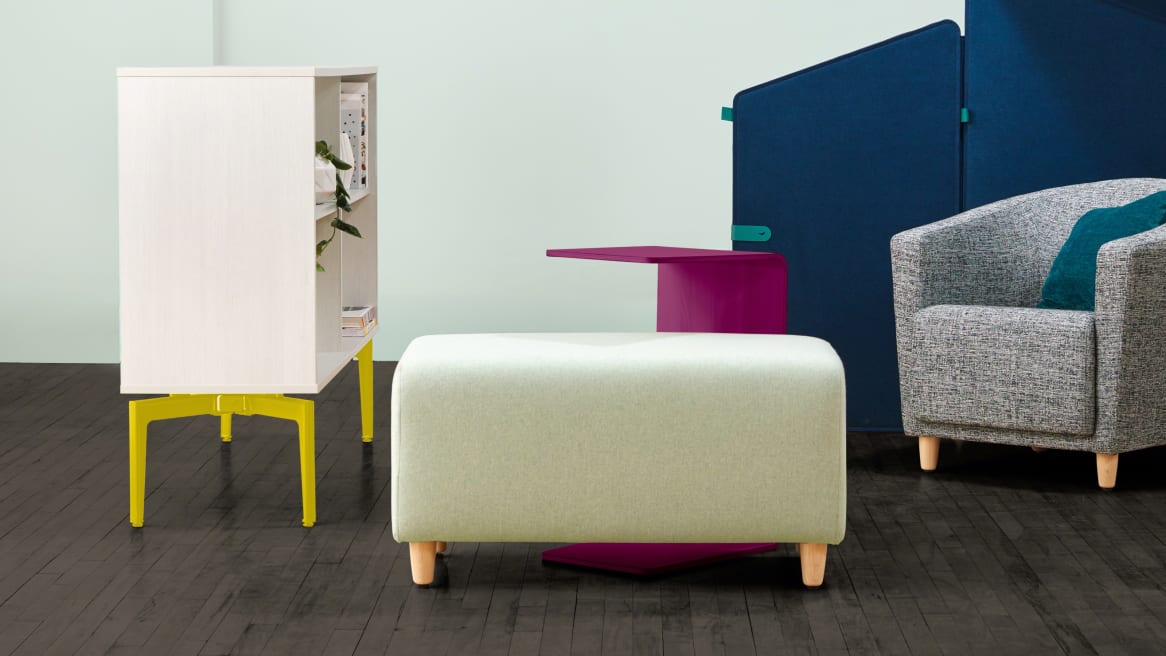 An Alight bench is in the foreground with a Campfire Personal Table and Bassline Standing Storage next to it. A Jenny Round chair and Clipper Screen are also pictured.