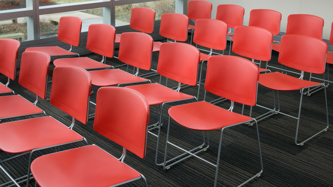 conference room set up with red Max Stacker III chairs