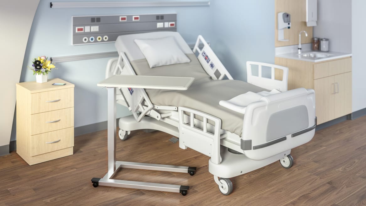 White, mobile overbed table in patient room setting