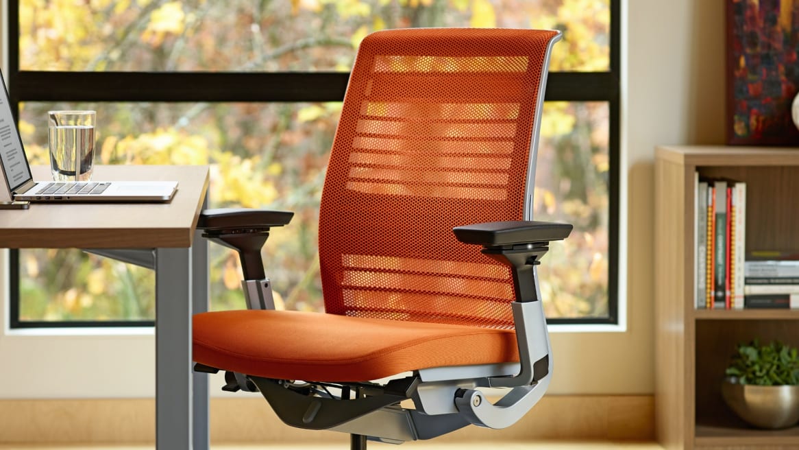 Close up to an orange Think chair
