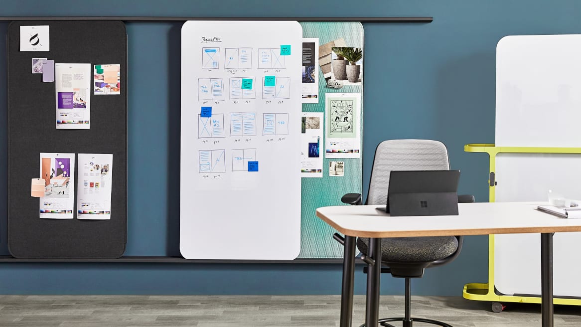 Steelcase Flex Markerboard Solutions arranges on a rail and on a Steelcase Flex Cart in an office space.