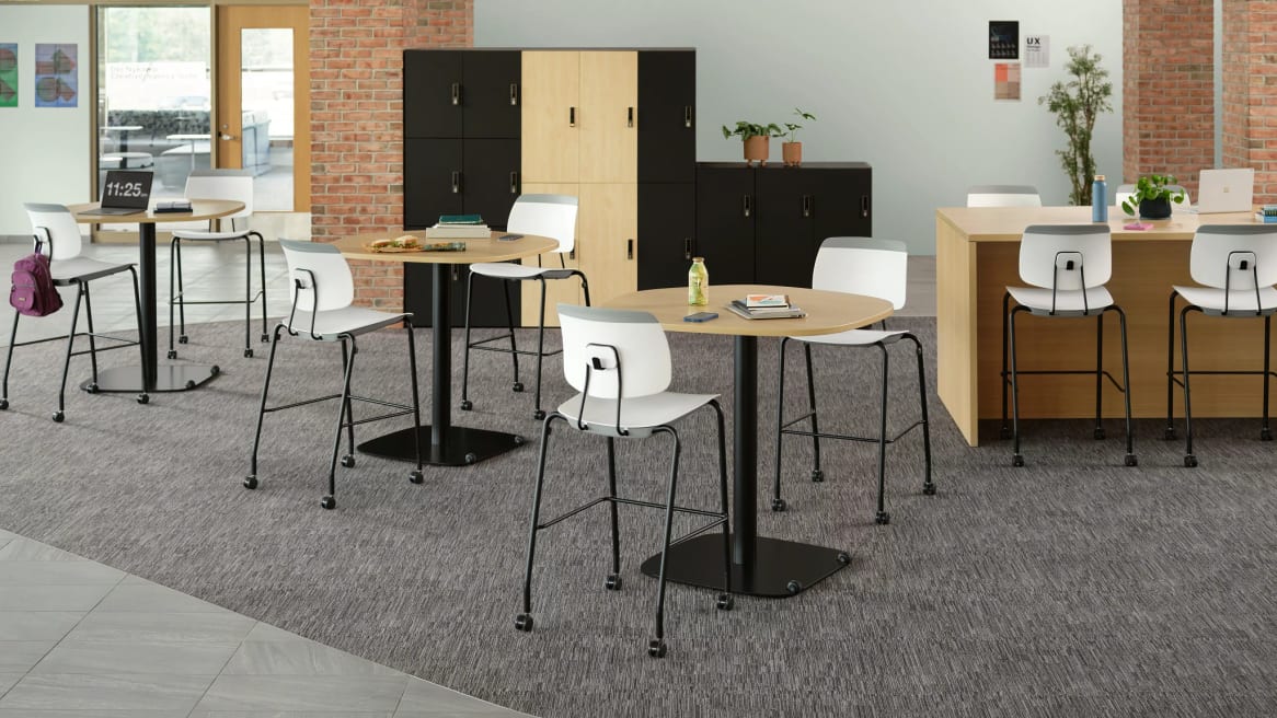 Tenor high stool with tables in an open space