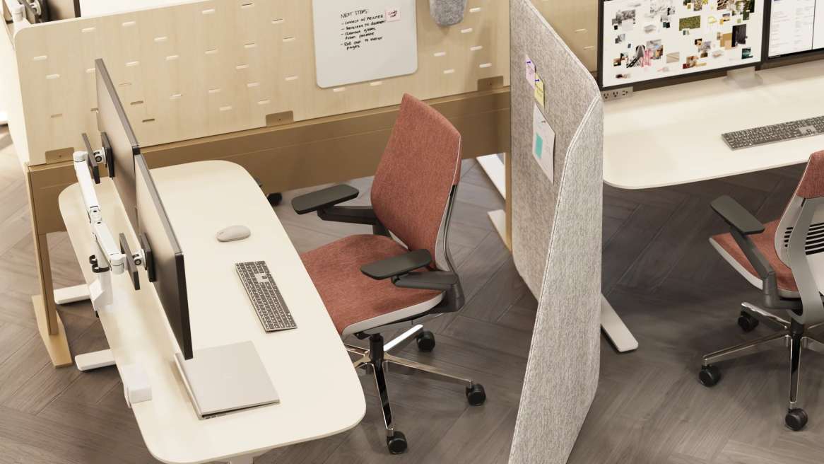 Brown Chair in front of a desk, inside an office.