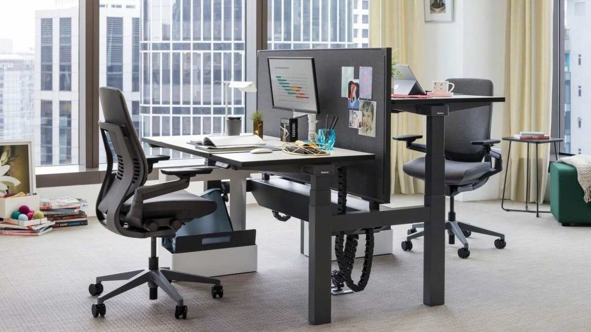 Office with black chairs next to a desk.