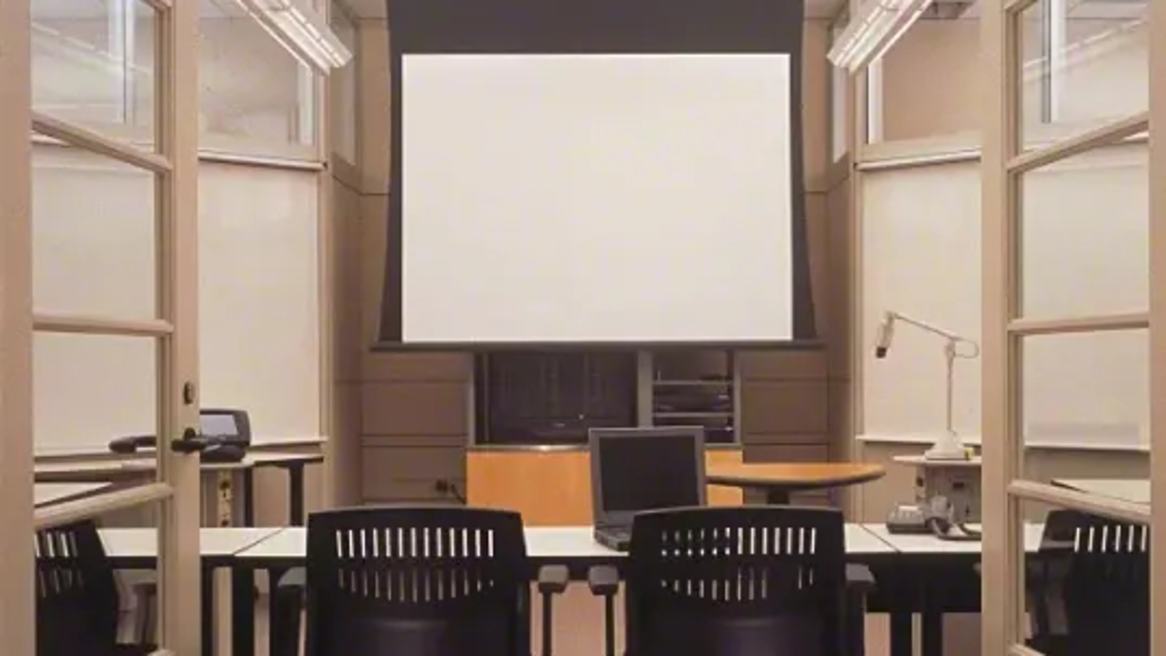 Chairs in front of a whiteboard.