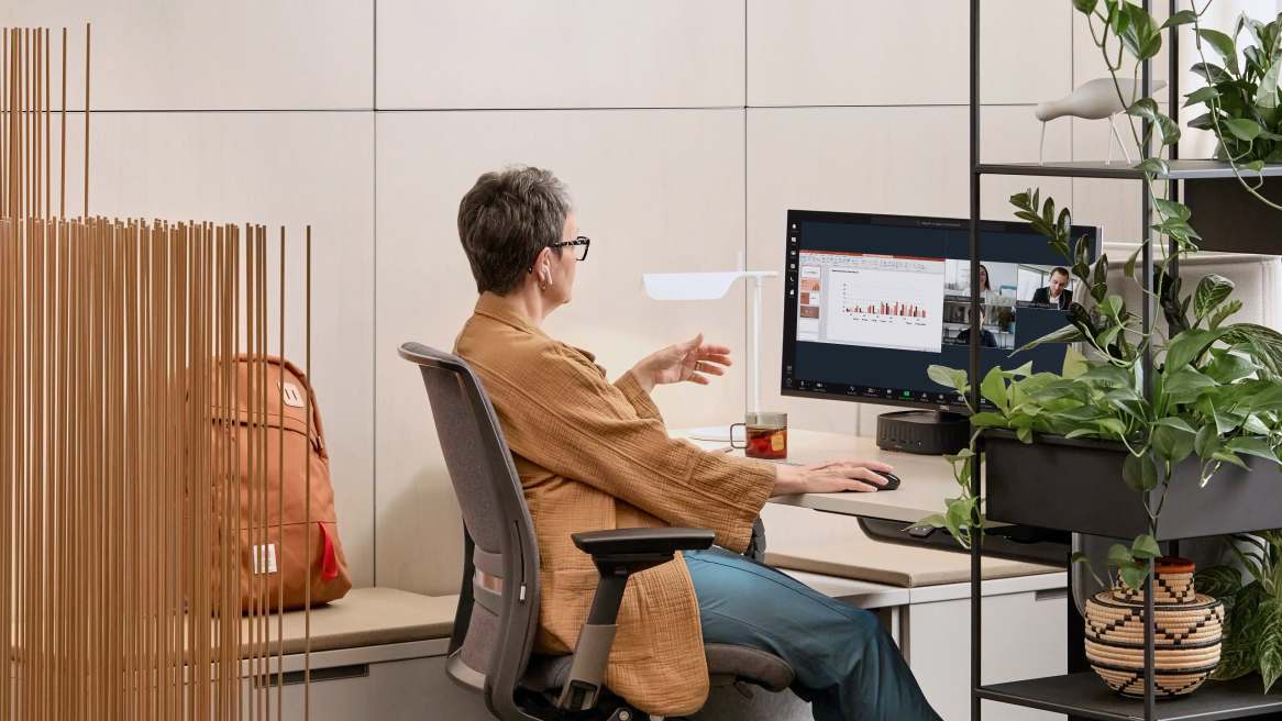 Woman working in an office on an individual desk