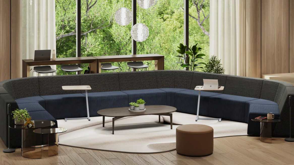 Large Blue Campfire Lounge next to plants and a brown table.