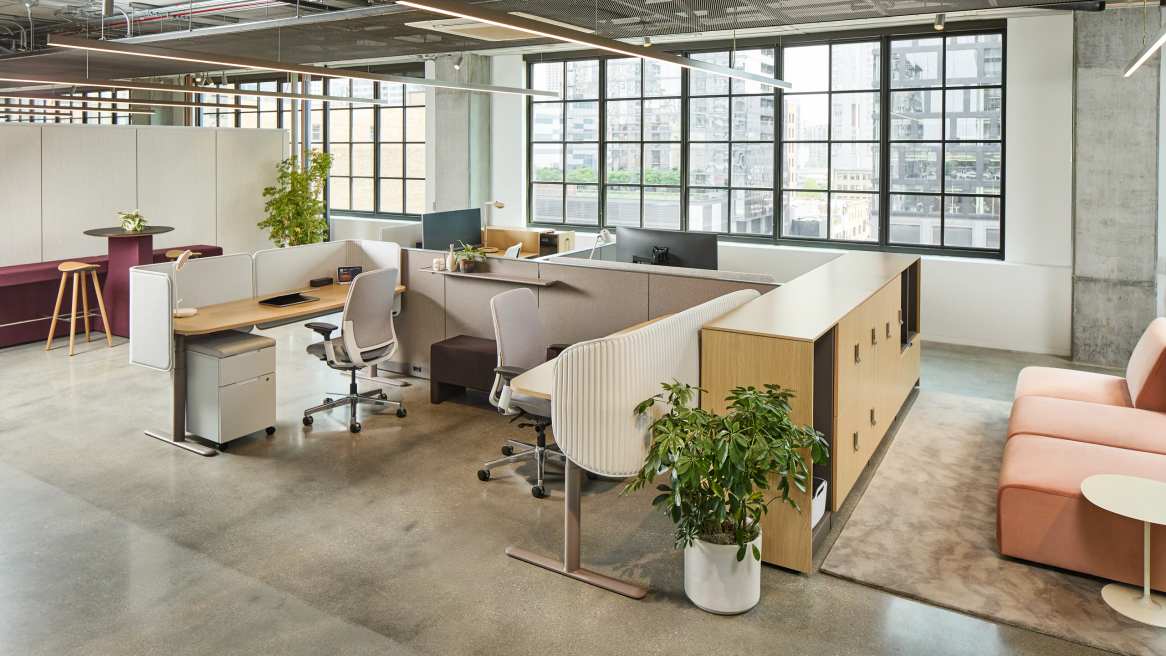 Office with chairs surrounding a desk.