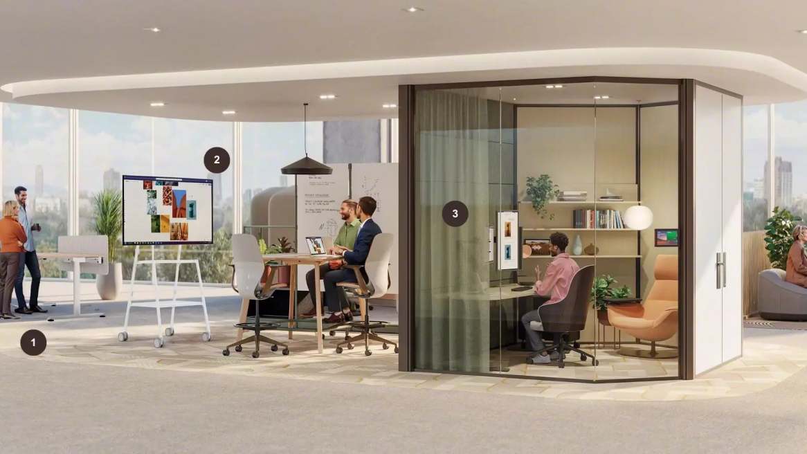 Hybrid workplace with collaborative meeting areas, presentation spaces and enclosed rooms supporting in-person and virtual teamwork.