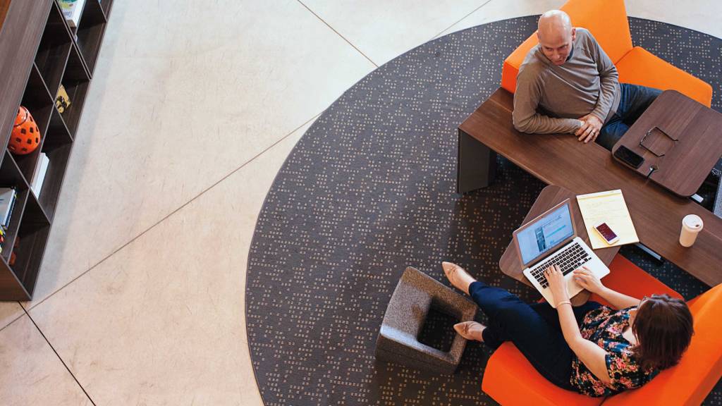 Campfire Slim Table, Skate Table and Footrest create a lounge environment that allows for easy collaboration.