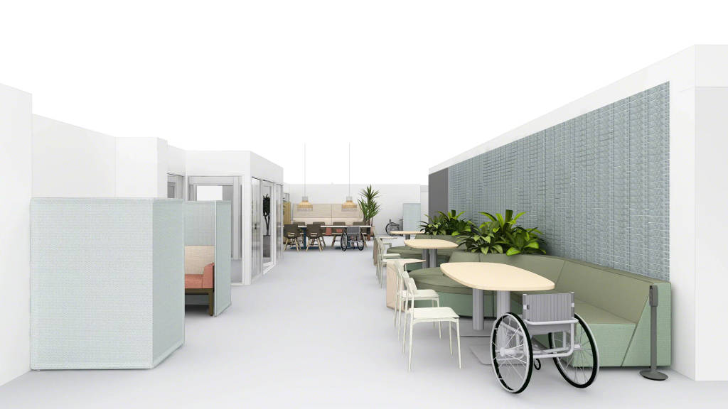 An office cafe space designed to dampen sound and accommodate mobility devices like wheelchairs