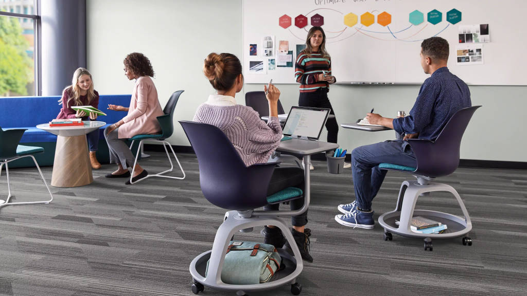 people seated on Node chairs while working and collaborating