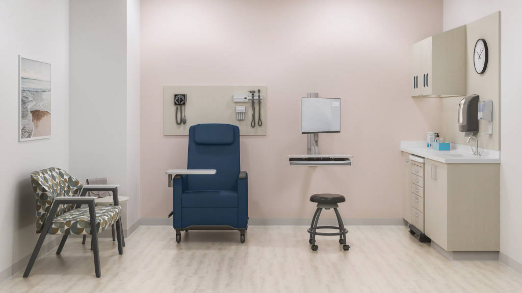 Picture of a patient waiting room with a sofa, chair and doctor’s stool.