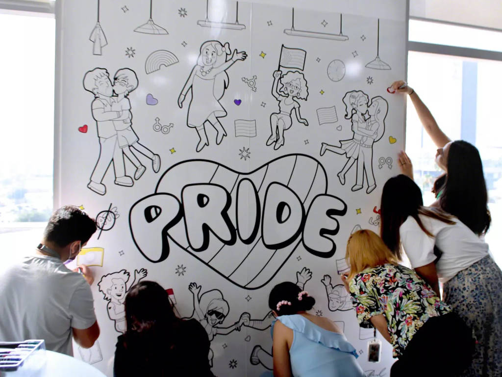 Steelcase employees color a Pride mural in Monterrey, Mexico.