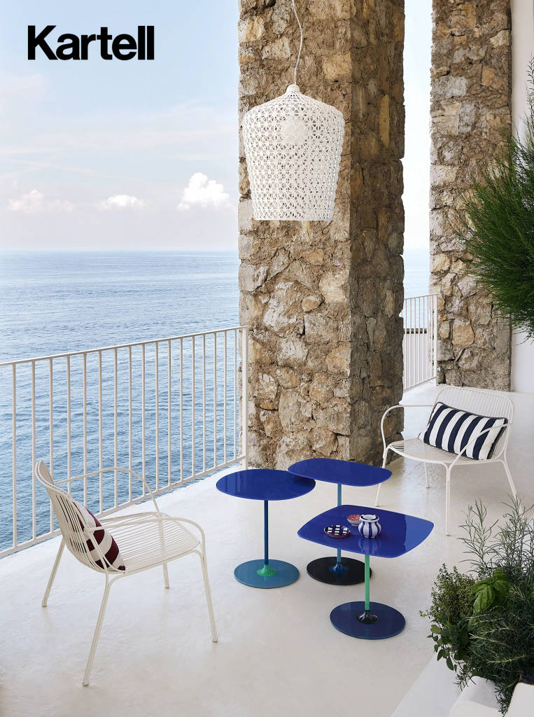 Chair and small tables at an open space with sea view