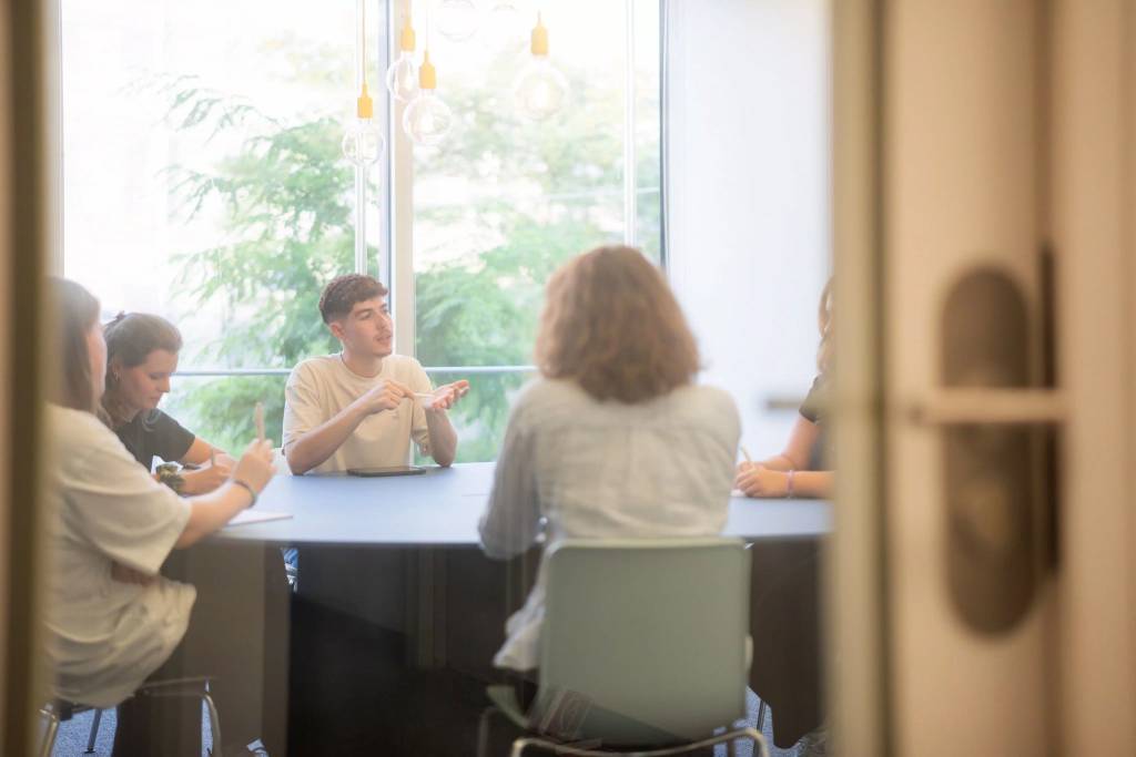 People interacting during a meeting