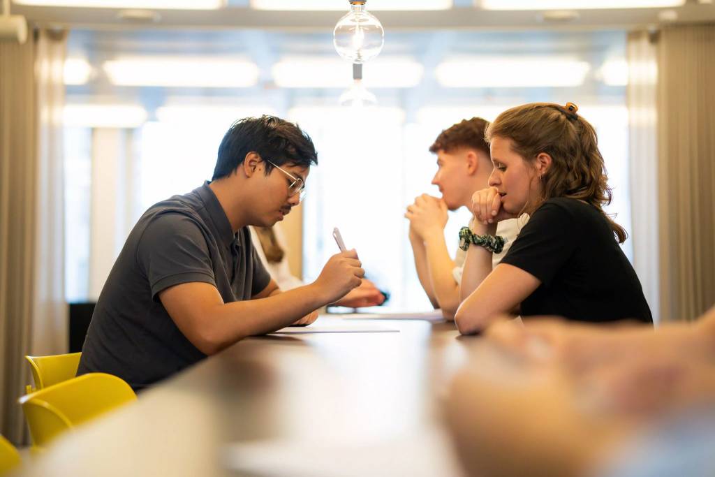 People interacting during a meeting
