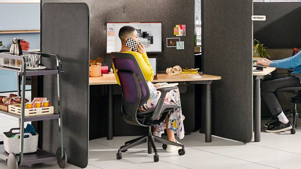 woman talking on the phone at her desk