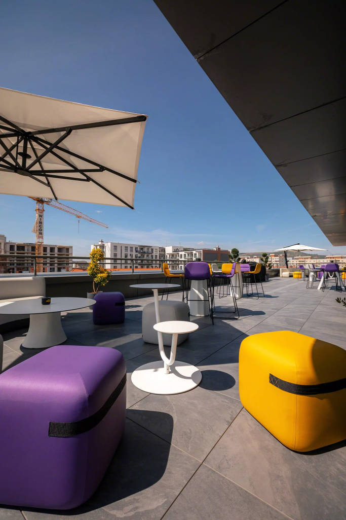 RebelDot office rooftop terrace featuring Season stools, Solar tables and Cambio tables