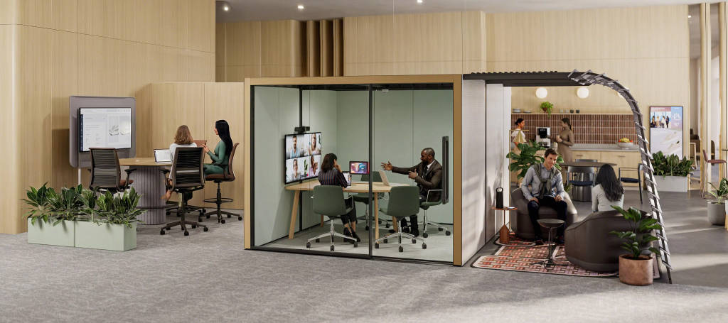 Steelcase office design combining enclosed collaboration rooms, hybrid meeting technology, focus workspaces, social areas, and ergonomic furniture to enhance employee experience and productivity.