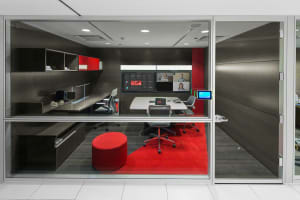 Collaborative office space with RoomWizard by office door