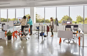 Steelcase Flex Collection products are used in an office setting. Steelcase Gesture chairs are also seen.