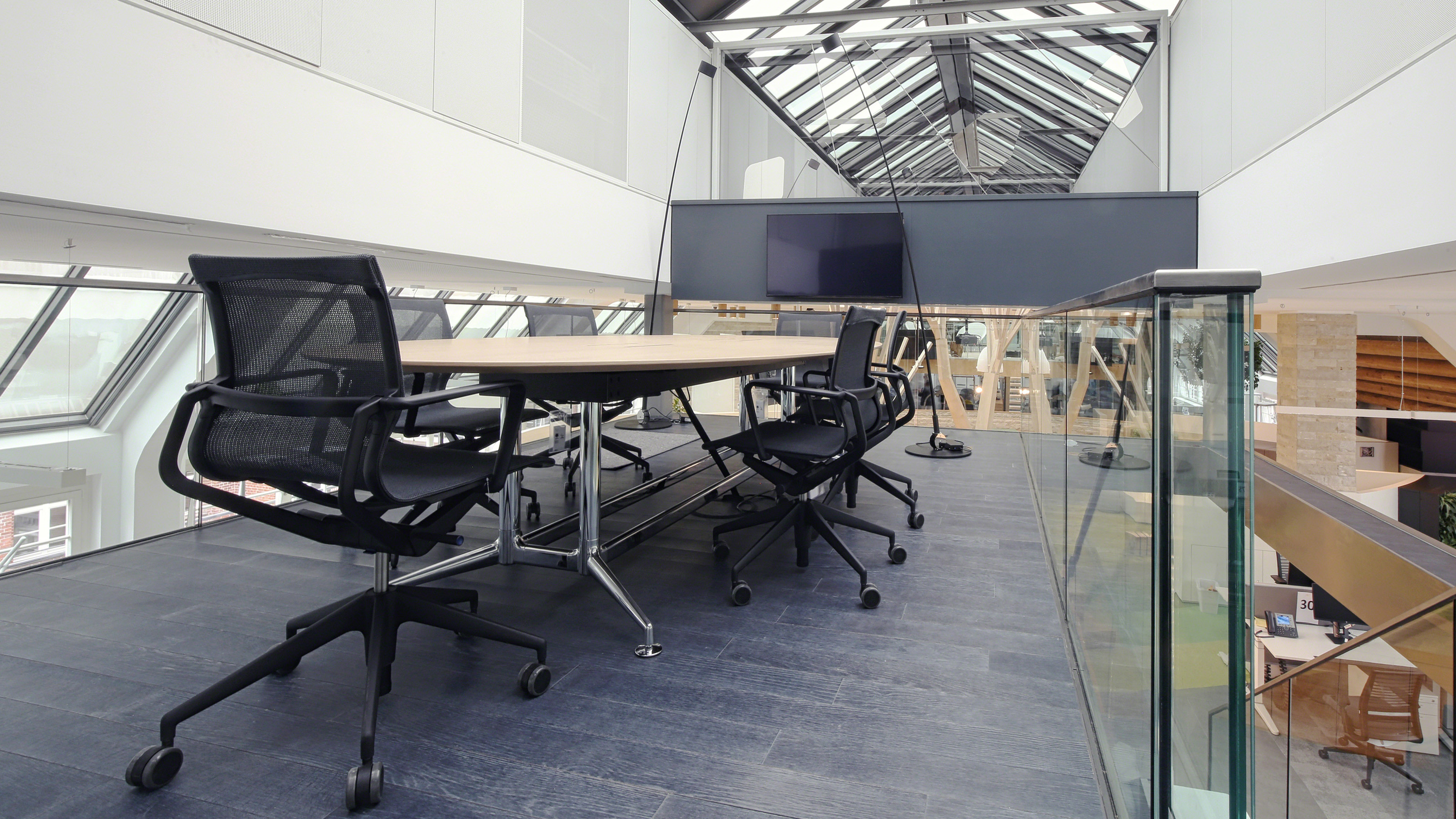 open office meeting area with black office chairs