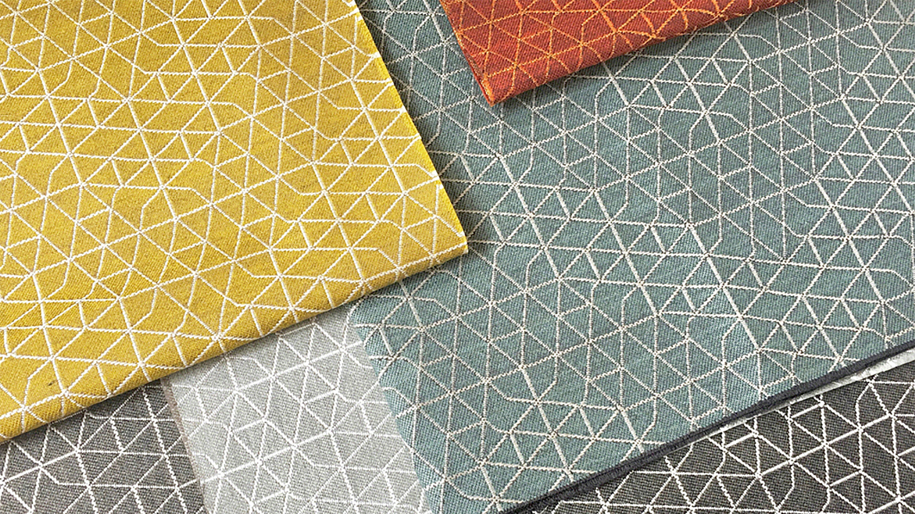 upholstery samples in a variety of colors with geometric embroidery