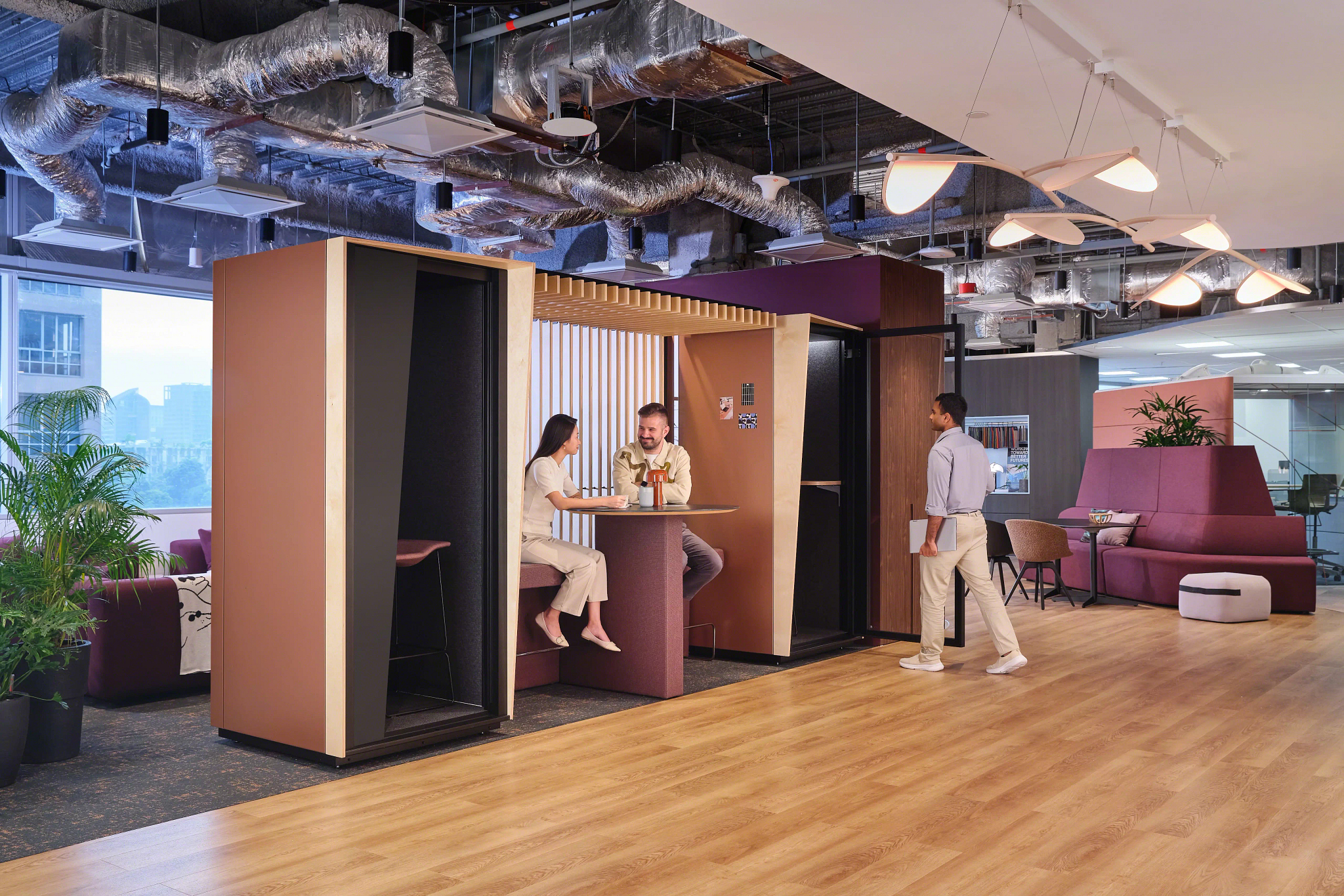 Orangebox Be my guest® phone booth with canopy and wall in an office environment
